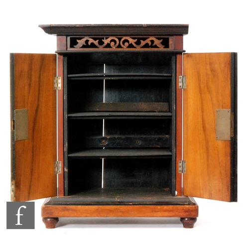 306 - A musical wall mounted cabinet with coin in the slot operation, later fitted shelf interior enclosed... 