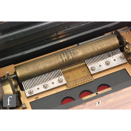 321 - A musical box playing ten airs, eighteen key organ section, tune card, cylinder 23.5cm with crossban... 