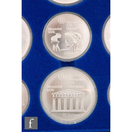 398 - Canada - Twenty silver proof coins to comemmorate the Canadian Olympics 1976, with booklet cased.