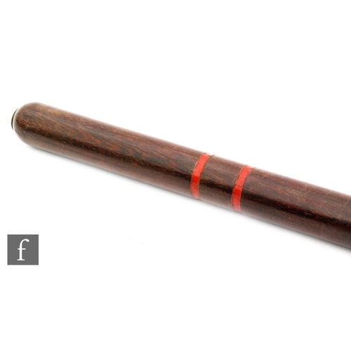 65 - A World War One mahogany service night stick, the end mounted with a brass stud and S O crown detail... 