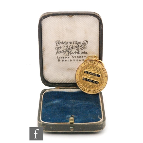 40 - A late 19th Century 9ct hallmarked Football League medal awarded to William (Billy) Bassett of West ... 