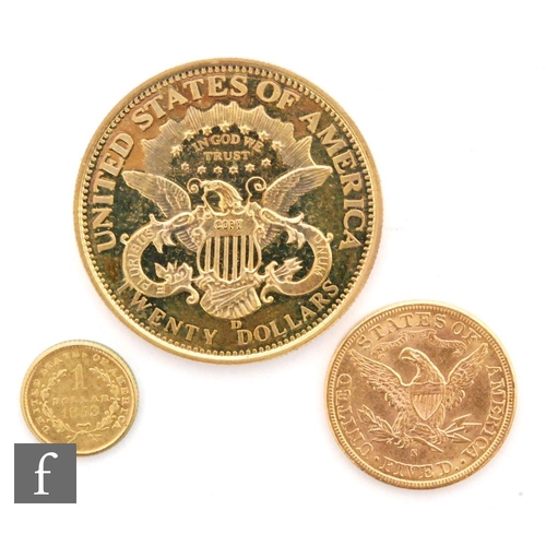 515 - America - A five dollar bears date 1885, a plated 1853 dollar and a replica plated twenty dollar pie... 