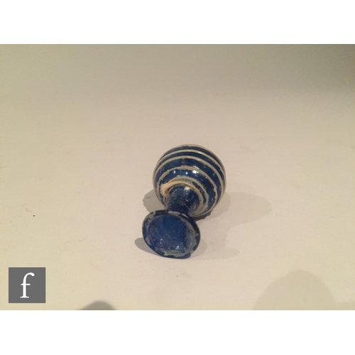 127 - Roman 2nd to 4th Century AD - A miniature cobalt blue globular form flask decorated with white bee h... 