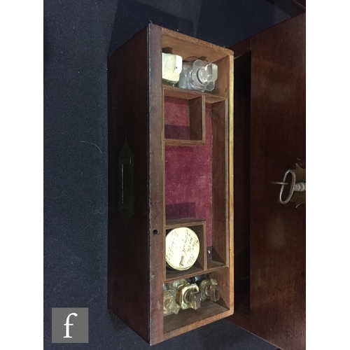 72 - A 19th Century mahogany apothecary box, the case opening to reveal an arrangement of seven bottles a... 