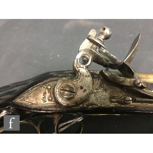 369 - An early 19th Century flintlock pistol, tower and GR mark to lock, brass trigger guard and the butt ... 