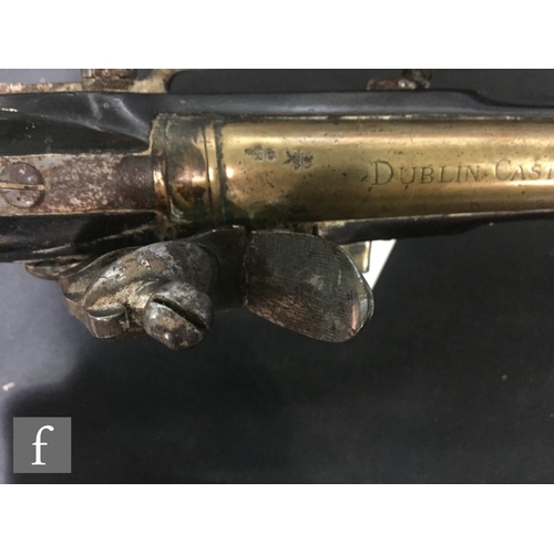 369 - An early 19th Century flintlock pistol, tower and GR mark to lock, brass trigger guard and the butt ... 