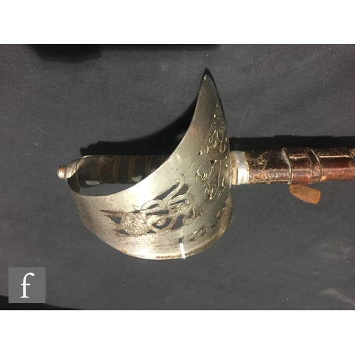 381 - An early 20th Century Artillery officers sword and leather scabbard, stamped C Boyton Clerkenwell EC... 