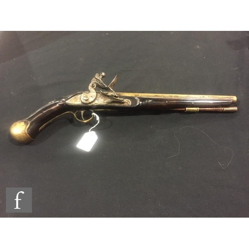 369 - An early 19th Century flintlock pistol, tower and GR mark to lock, brass trigger guard and the butt ... 