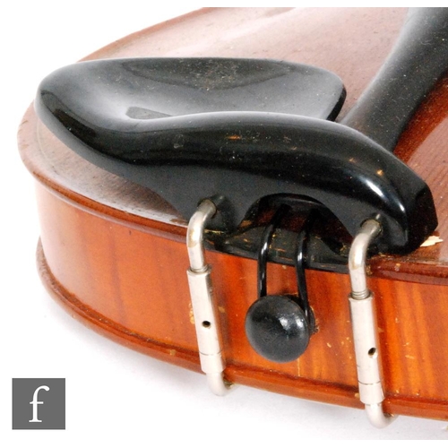 58 - A 1920 to 1930's violin, the reverse stamped Stainer, length of back 35.5cm and with a bow, cased.