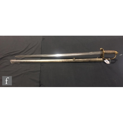 331 - A George V artillery officers dress sword and scabbard with pierced D shaped guard and ray skin hand... 