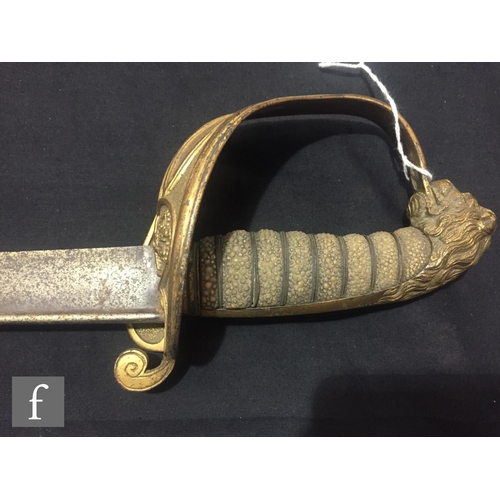 343 - A 19th Century naval officers dress sword with hinged guard and lion pommel, a World War One officer... 