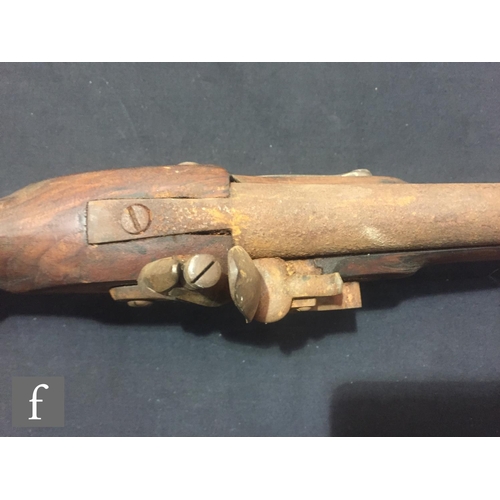 340 - An Indian flintlock blunderbuss with ramrod and brass trigger guard, length 45cm and a single barrel... 