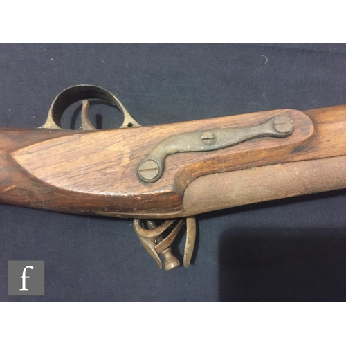 340 - An Indian flintlock blunderbuss with ramrod and brass trigger guard, length 45cm and a single barrel... 