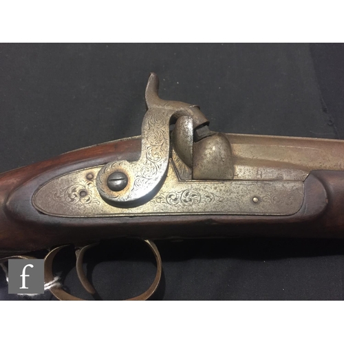 340 - An Indian flintlock blunderbuss with ramrod and brass trigger guard, length 45cm and a single barrel... 