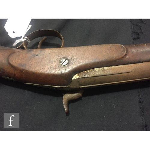 340 - An Indian flintlock blunderbuss with ramrod and brass trigger guard, length 45cm and a single barrel... 