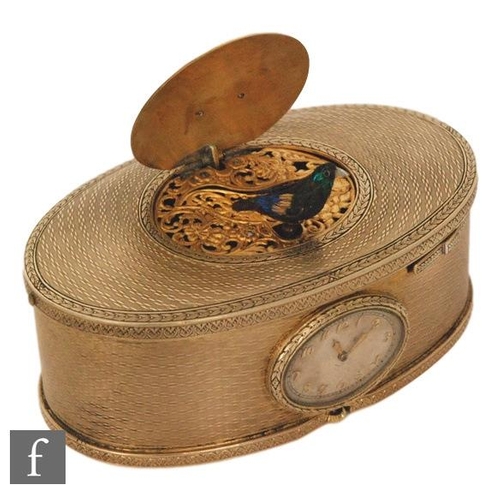 355 - A 19th Century continental silver gilt singing bird box, the engine turned oval box with a watch to ... 