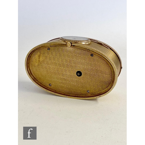 355 - A 19th Century continental silver gilt singing bird box, the engine turned oval box with a watch to ... 