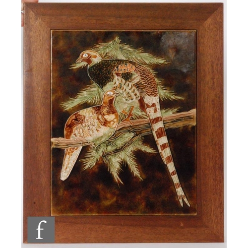 115 - A large rectangular tile, attributed to Maw & Co, decorated with two tubelined pheasants perched upo... 