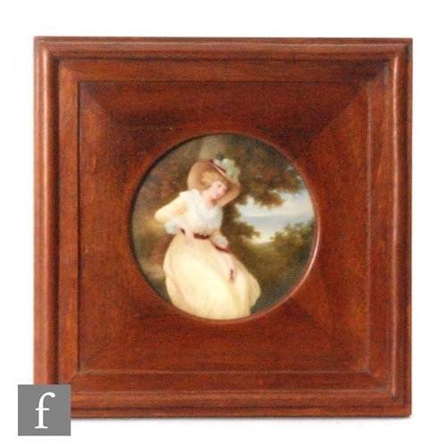 120 - An early 20th Century circular porcelain panel decorated by Leslie Johnson with a hand painted portr... 
