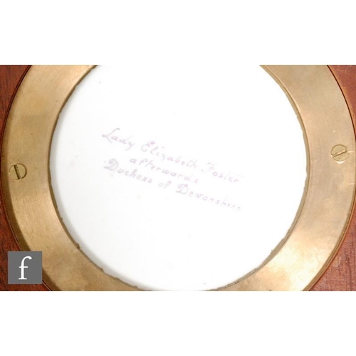 120 - An early 20th Century circular porcelain panel decorated by Leslie Johnson with a hand painted portr... 