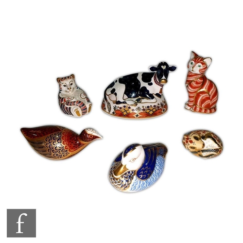27 - Six assorted Royal Crown Derby paperweights to include a Fresian Cow Buttercup, a cat and a duck, al... 