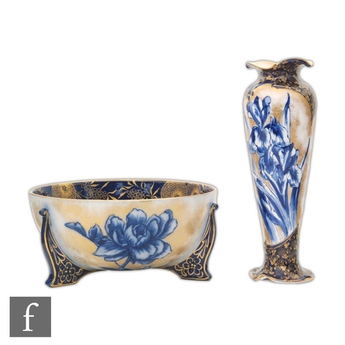 31 - An early 20th Century Doulton Burslem Flow Blue vase decorated with daffodils against a white ground... 