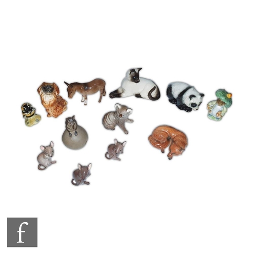 51 - A collection of assorted Beswick animals to include a Pekinese model 1059, a Fox model 1017, a Koala... 