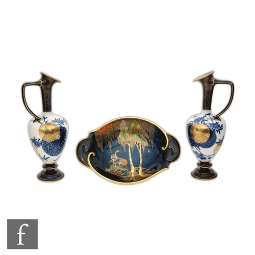 56 - A pair of late 19th Century Doulton Aesthetic ewers decorated with mon motif and floral sprays, all ... 