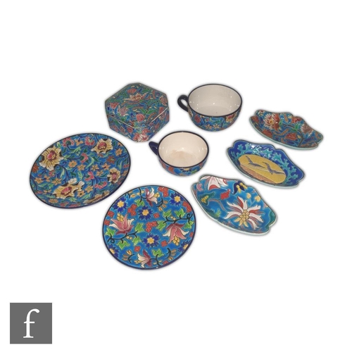 96 - A small collection of assorted Longwy to include  a teacup and saucer decorated with stylised flower... 