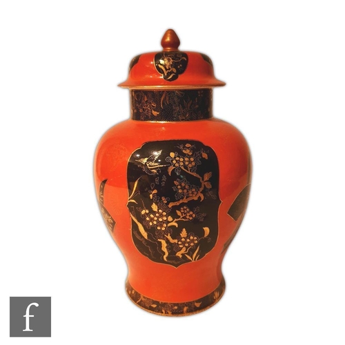 99 - A 1920s Wiltshaw and Robinson Carlton Ware Kien Lung vase and cover decorated with black and gilt ca... 