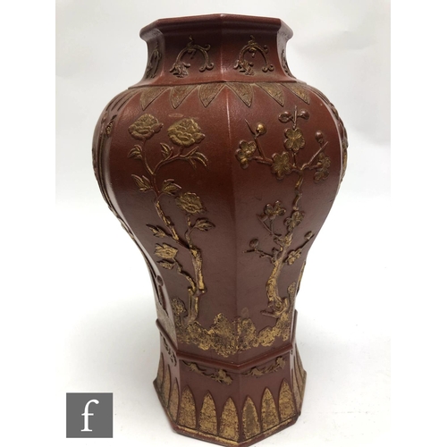 168 - A Chinese late Qing Dynasty (1644-1912) Yixing vase, the octagonal meiping vase relief moulded to th... 
