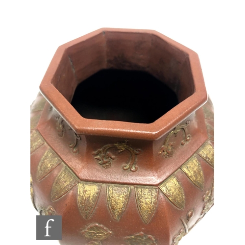 168 - A Chinese late Qing Dynasty (1644-1912) Yixing vase, the octagonal meiping vase relief moulded to th... 