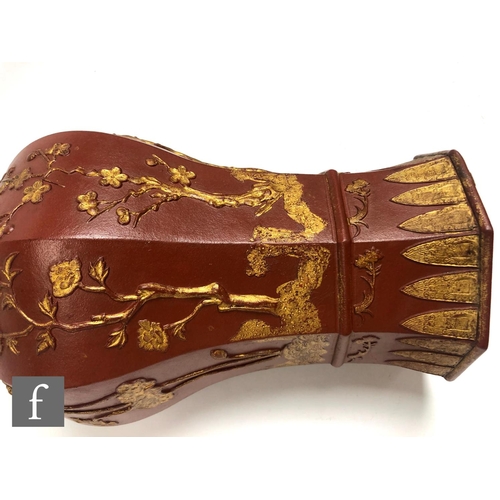 168 - A Chinese late Qing Dynasty (1644-1912) Yixing vase, the octagonal meiping vase relief moulded to th... 