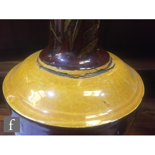 94 - A pair of late 19th Century Bretby Pottery vases, each of slender ovoid form, rising from a stepped ... 