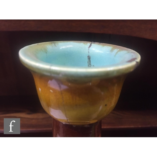 94 - A pair of late 19th Century Bretby Pottery vases, each of slender ovoid form, rising from a stepped ... 