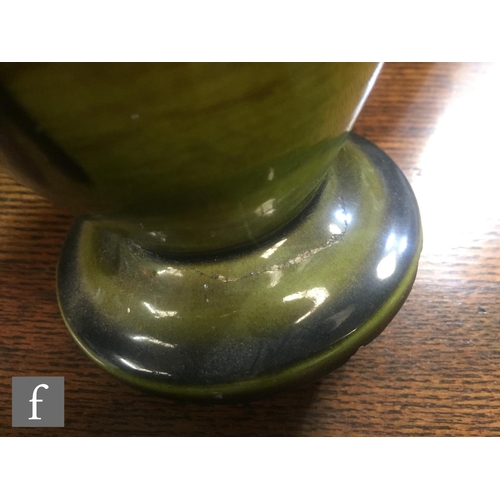 94 - A pair of late 19th Century Bretby Pottery vases, each of slender ovoid form, rising from a stepped ... 