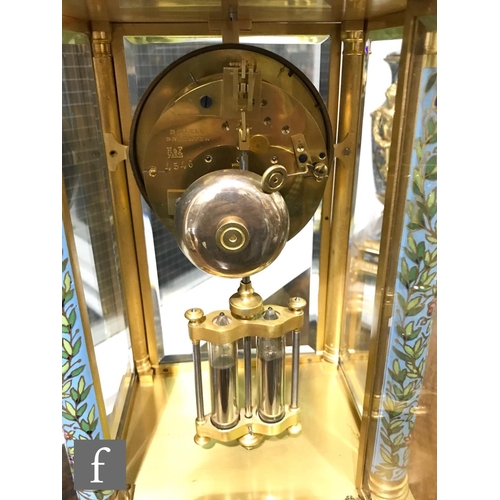 927 - A late 19th Century French ormolu and champleve enamel clock garniture, the four sided glass panel c... 