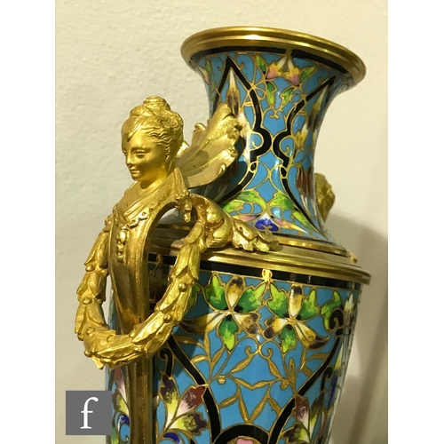 927 - A late 19th Century French ormolu and champleve enamel clock garniture, the four sided glass panel c... 