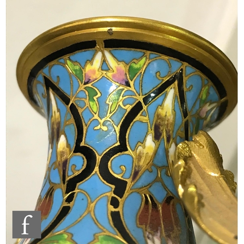 927 - A late 19th Century French ormolu and champleve enamel clock garniture, the four sided glass panel c... 