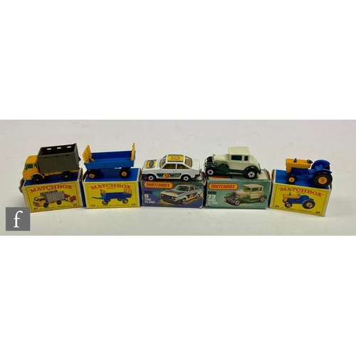 107 - A collection of Matchbox Lesney diecast models, comprising 39c Ford Tractor in blue with yellow engi... 