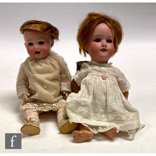 190 - A Schoneau and Hoffmeister bisque head doll, head mould 914, with sleeping blue eyes, open mouth wit... 
