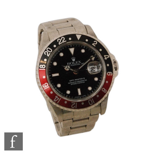 342 - A gentleman's stainless steel wrist watch, Rolex GMT Master II, 16710, 'Coke' bezel, black dial with... 