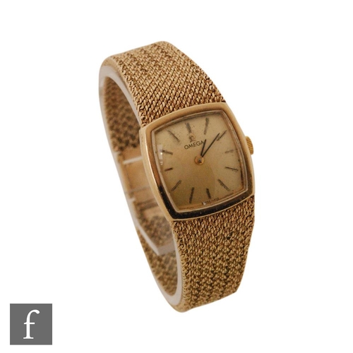 343 - A 9ct hallmarked lady's Omega manual wrist watch, batons to a square, champagne dial, all to an inte... 