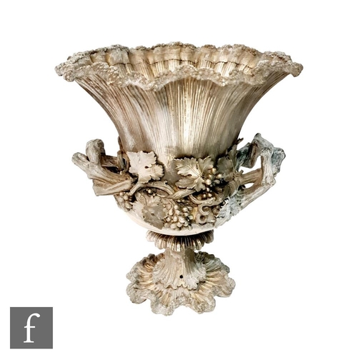 90 - A Georgian hallmarked silver campana urn shaped wine cooler shaped circular base below fruiting vine... 