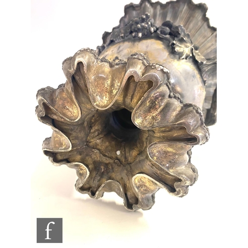 90 - A Georgian hallmarked silver campana urn shaped wine cooler shaped circular base below fruiting vine... 