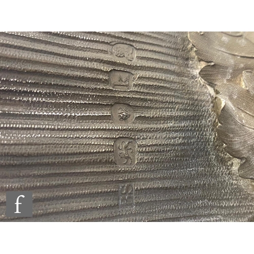 90 - A Georgian hallmarked silver campana urn shaped wine cooler shaped circular base below fruiting vine... 