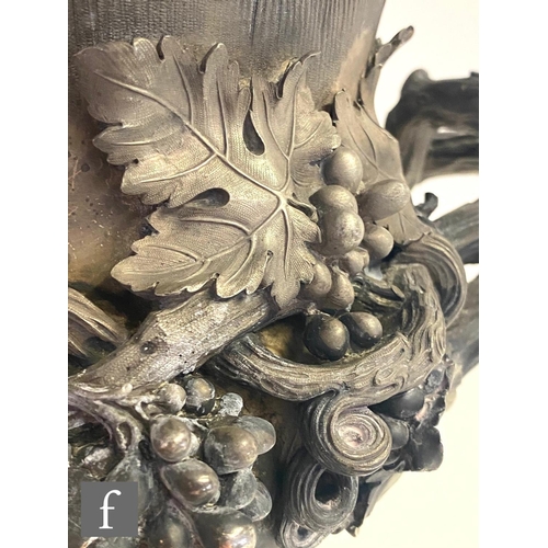 90 - A Georgian hallmarked silver campana urn shaped wine cooler shaped circular base below fruiting vine... 