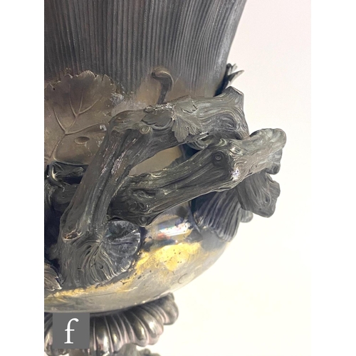 90 - A Georgian hallmarked silver campana urn shaped wine cooler shaped circular base below fruiting vine... 