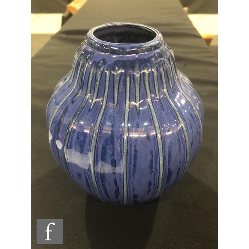 40 - Doulton Lambeth - An early 20th Century vase of gourd form, the whole decorated in a streaked blue g... 