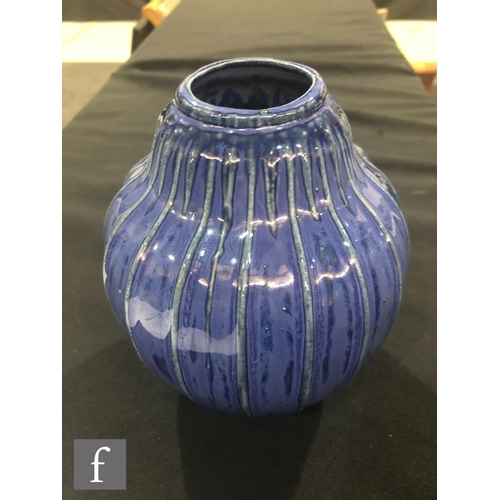 40 - Doulton Lambeth - An early 20th Century vase of gourd form, the whole decorated in a streaked blue g... 